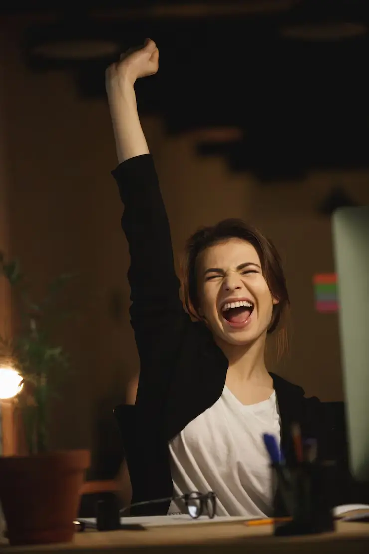 yawning-young-lady-designer-sitting-office-night_171337-15582